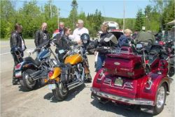 Motorcyclists have a riders' meeting before taking a group ride