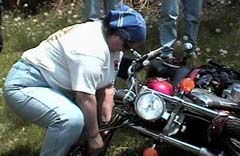 Member shows how to lift a fallen motorcycle
